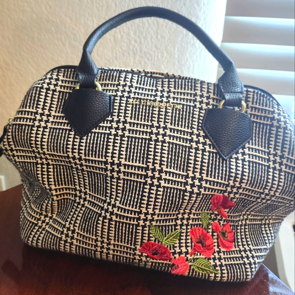 Stylish Liz Claiborn brand black and White Handbag displaying red florals
